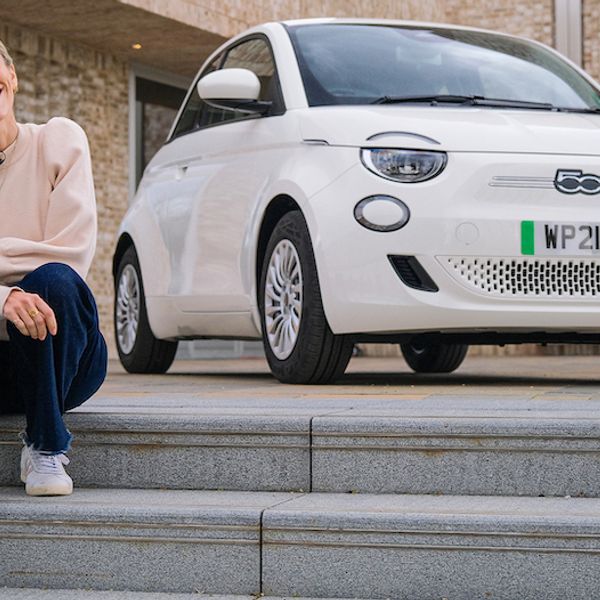 Nicki Shields with a white Fiat 500e